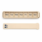 Beige Glidra 7-day pill organizer by InnoLab Design, travel-safe with plant-based materials, featuring multiple compartments for daily pills.