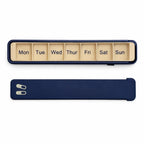 Navy Glidra 7-day pill organizer by InnoLab Design with individual compartments for daily medication storage.