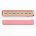 Pink Glidra 7-day pill organizer by InnoLab Design featuring separate compartments for each day, travel-safe and plant-based.