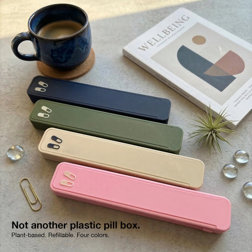 Glidra weekly pill organizer in navy with slide-lock lids